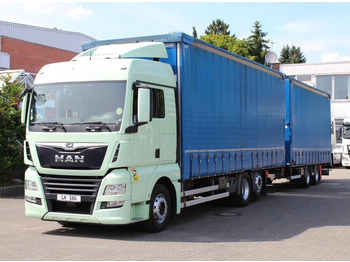 Тентованный грузовик MAN TGX 26.460