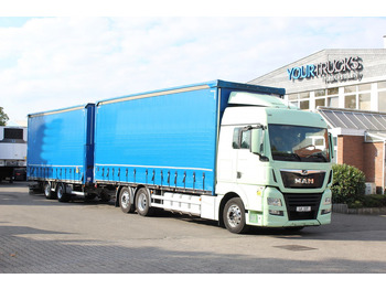 Тентованный грузовик MAN TGX 26.460