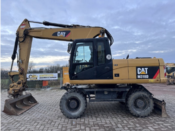 Колёсный экскаватор CATERPILLAR M318D