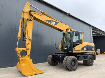 Колёсный экскаватор CATERPILLAR M322C