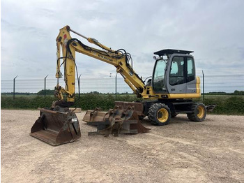 Колёсный экскаватор NEW HOLLAND