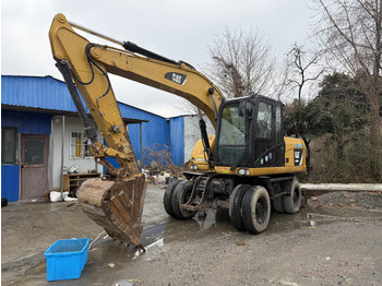 Колёсный экскаватор CATERPILLAR M312