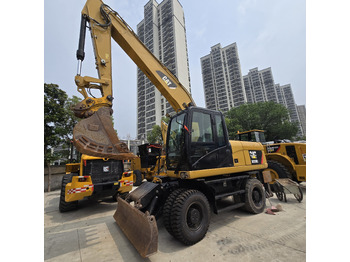 Колёсный экскаватор CATERPILLAR M320