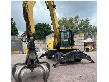 Колёсный экскаватор CAT 3022: фото 2