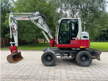Колёсный экскаватор TAKEUCHI