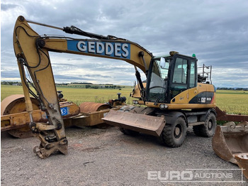 Колёсный экскаватор CATERPILLAR M313D