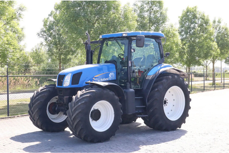 New Holland TS135A | 40 KM/H | 4X4 | SUPERSTEER - Трактор: фото 1 New Holland TS135A | 40 KM/H | 4X4 | SUPERSTEER - Трактор: фото 1