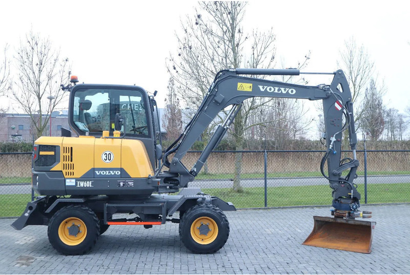 Volvo EW60E | DEMO | 30 KM/H | ROTOTILT + GRIPPER | BUCKET - Колёсный экскаватор: фото 4 Volvo EW60E | DEMO | 30 KM/H | ROTOTILT + GRIPPER | BUCKET - Колёсный экскаватор: фото 4