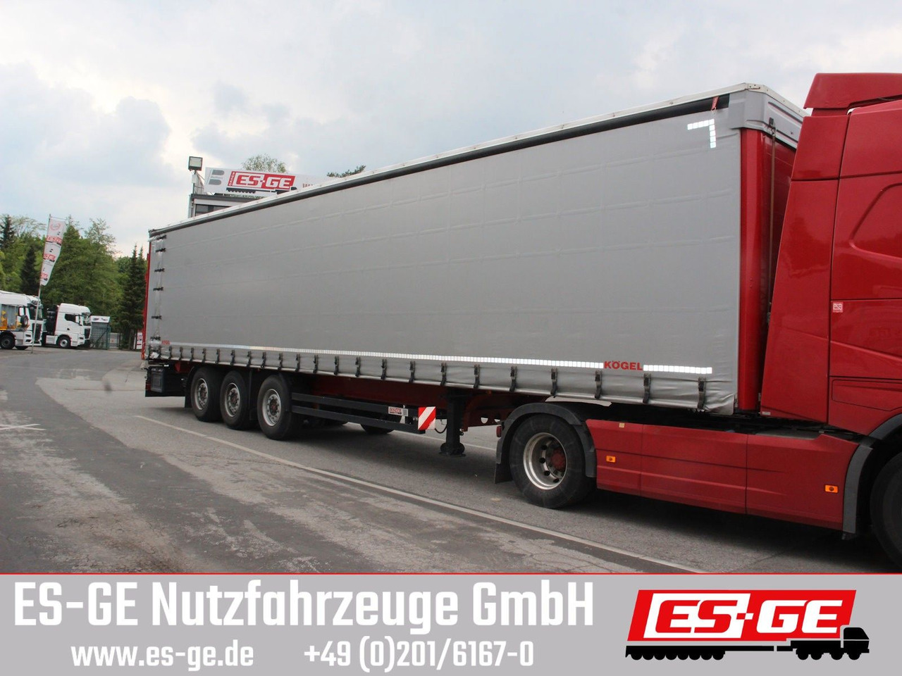 Kögel 3-Achs-Cargo-Coil-Pritschensattelanhänger Kögel 3-Achs-Cargo-Coil-Pritschensattelanhänger - Тентованный полуприцеп: фото 1 Kögel 3-Achs-Cargo-Coil-Pritschensattelanhänger Kögel 3-Achs-Cargo-Coil-Pritschensattelanhänger - Тентованный полуприцеп: фото 1