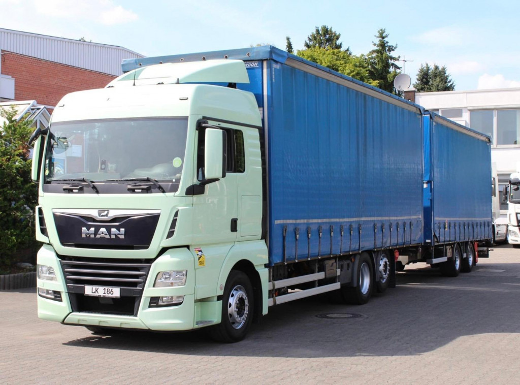 MAN TGX 26.460 Retarder Jumbo-Zug 120M3 Durchlade - Тентованный грузовик: фото 1 MAN TGX 26.460 Retarder Jumbo-Zug 120M3 Durchlade - Тентованный грузовик: фото 1