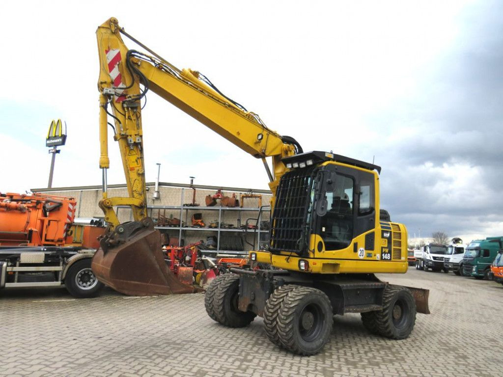 Komatsu Mobilbagger PW 148 - 8 Bagger 6.824h Deutsch top - Колёсный экскаватор: фото 1 Komatsu Mobilbagger PW 148 - 8 Bagger 6.824h Deutsch top - Колёсный экскаватор: фото 1