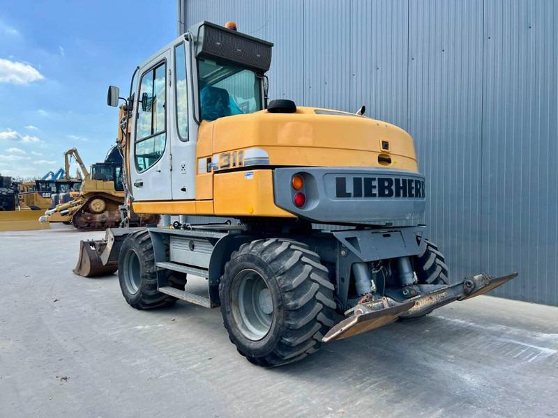 Liebherr A311 Litronic - Колёсный экскаватор: фото 2 Liebherr A311 Litronic - Колёсный экскаватор: фото 2
