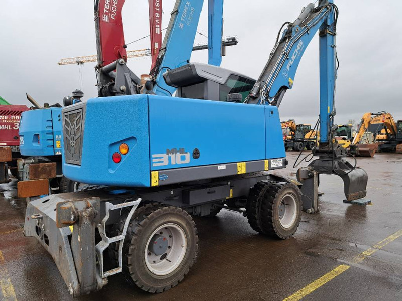 Fuchs MHL 310 - Перегружатель: фото 1 Fuchs MHL 310 - Перегружатель: фото 1