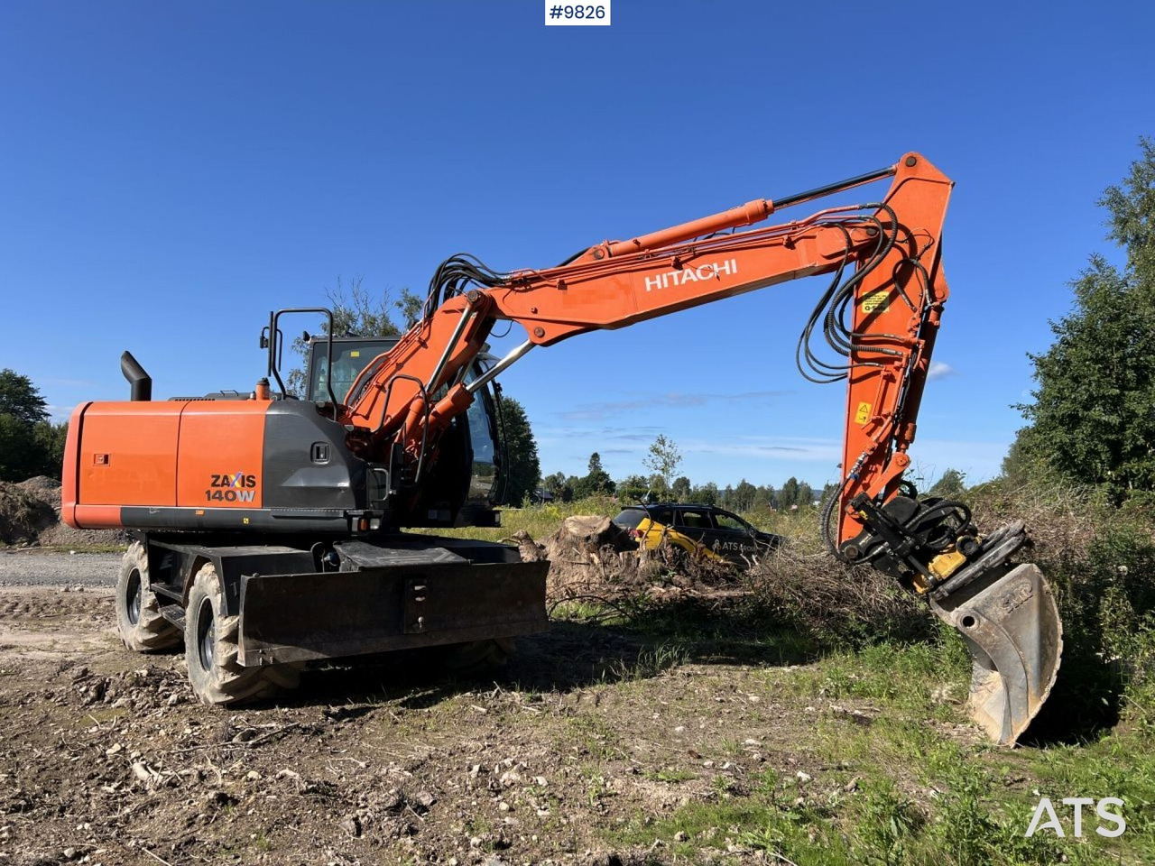 Hitachi ZX140 W-5B with rotor and planer bucket - Колёсный экскаватор: фото 1 Hitachi ZX140 W-5B with rotor and planer bucket - Колёсный экскаватор: фото 1