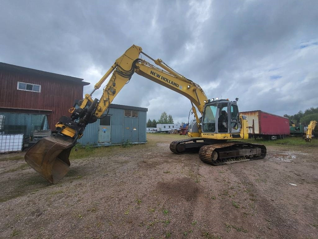 New Holland Kobelco E 235 B SR-2 - Гусеничный экскаватор: фото 1 New Holland Kobelco E 235 B SR-2 - Гусеничный экскаватор: фото 1