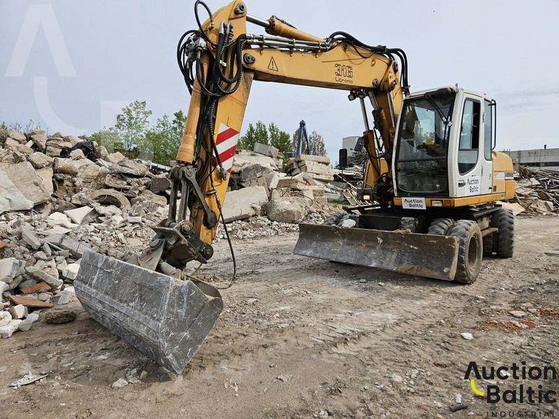 Liebherr A 316 Litronic - Колёсный экскаватор: фото 1 Liebherr A 316 Litronic - Колёсный экскаватор: фото 1
