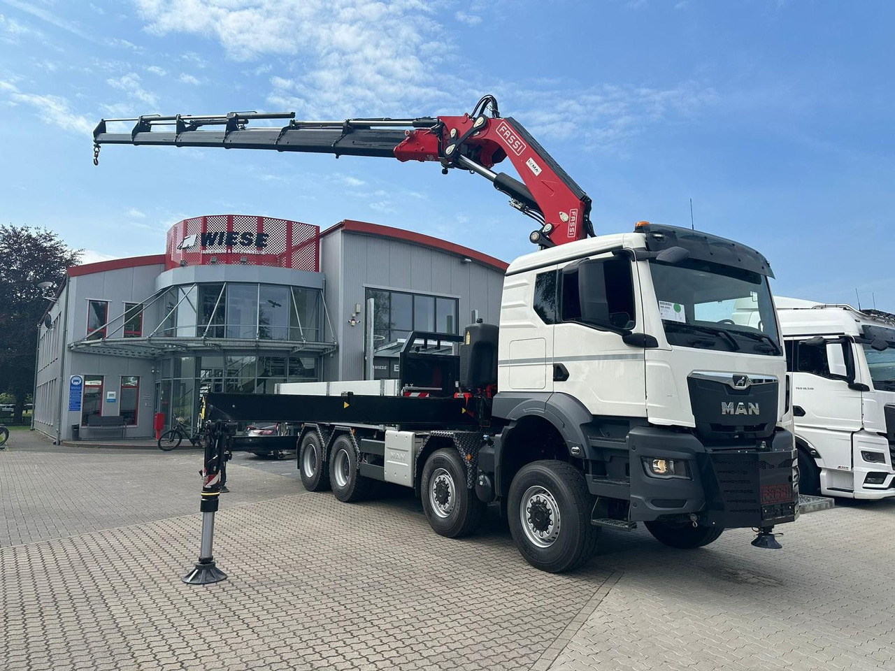 MAN TGS 41.520 8x8 mit Fassi Ladekran F710RA.2.26 - Грузовик бортовой/ Платформа: фото 1 MAN TGS 41.520 8x8 mit Fassi Ladekran F710RA.2.26 - Грузовик бортовой/ Платформа: фото 1