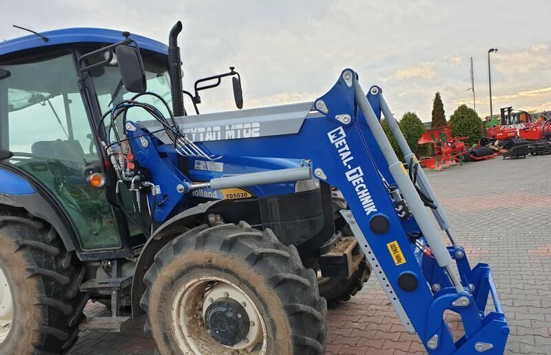 Metal-Technik für NEW HOLLAND TL 90 - Фронтальный погрузчик для трактора: фото 3 Metal-Technik für NEW HOLLAND TL 90 - Фронтальный погрузчик для трактора: фото 3