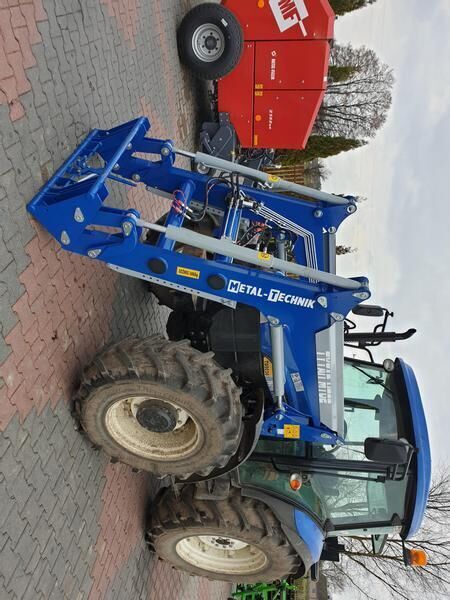 Metal-Technik für NEW HOLLAND TL 90 - Фронтальный погрузчик для трактора: фото 1 Metal-Technik für NEW HOLLAND TL 90 - Фронтальный погрузчик для трактора: фото 1