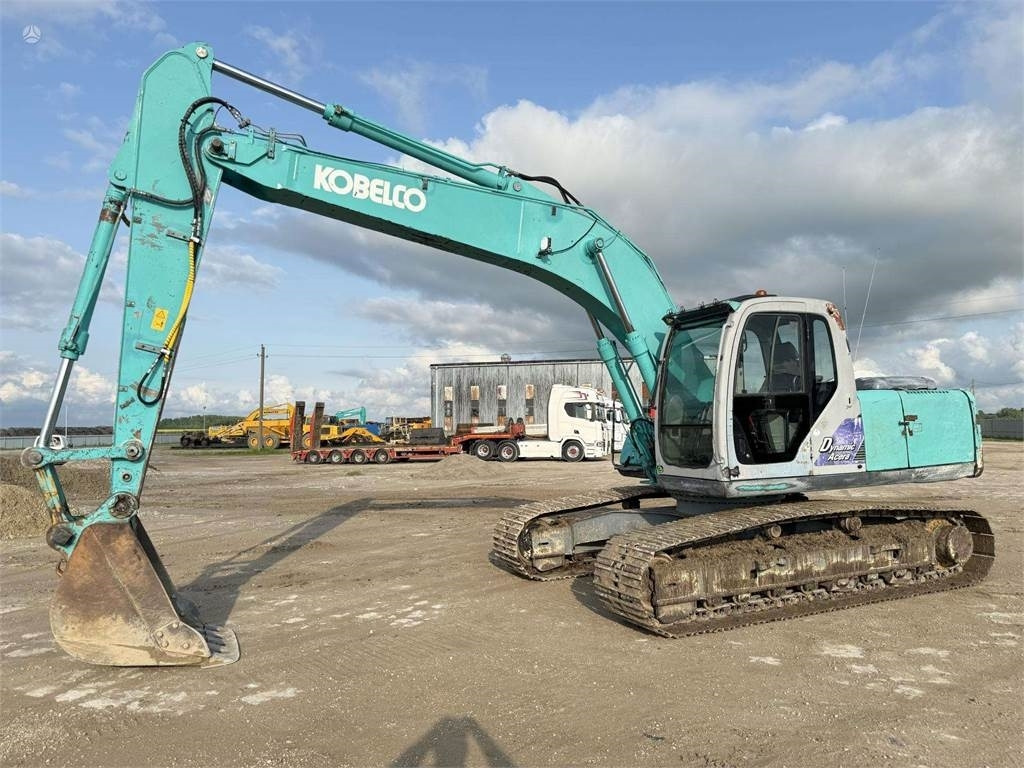 Kobelco SK 210'LC-6  - Гусеничный экскаватор: фото 1 Kobelco SK 210'LC-6  - Гусеничный экскаватор: фото 1