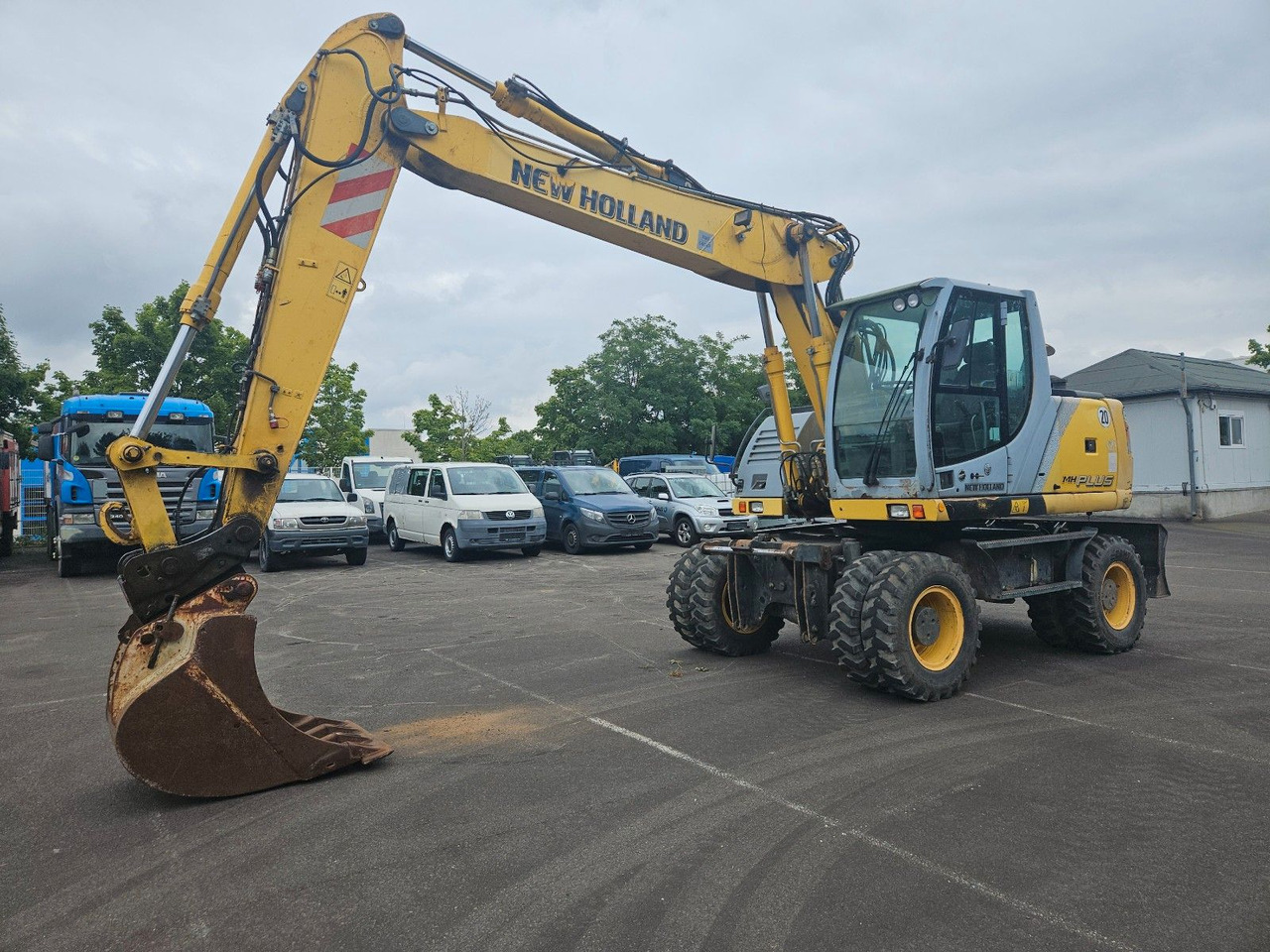 New Holland MH Plus 18t Mobilbagger - Колёсный экскаватор: фото 1 New Holland MH Plus 18t Mobilbagger - Колёсный экскаватор: фото 1