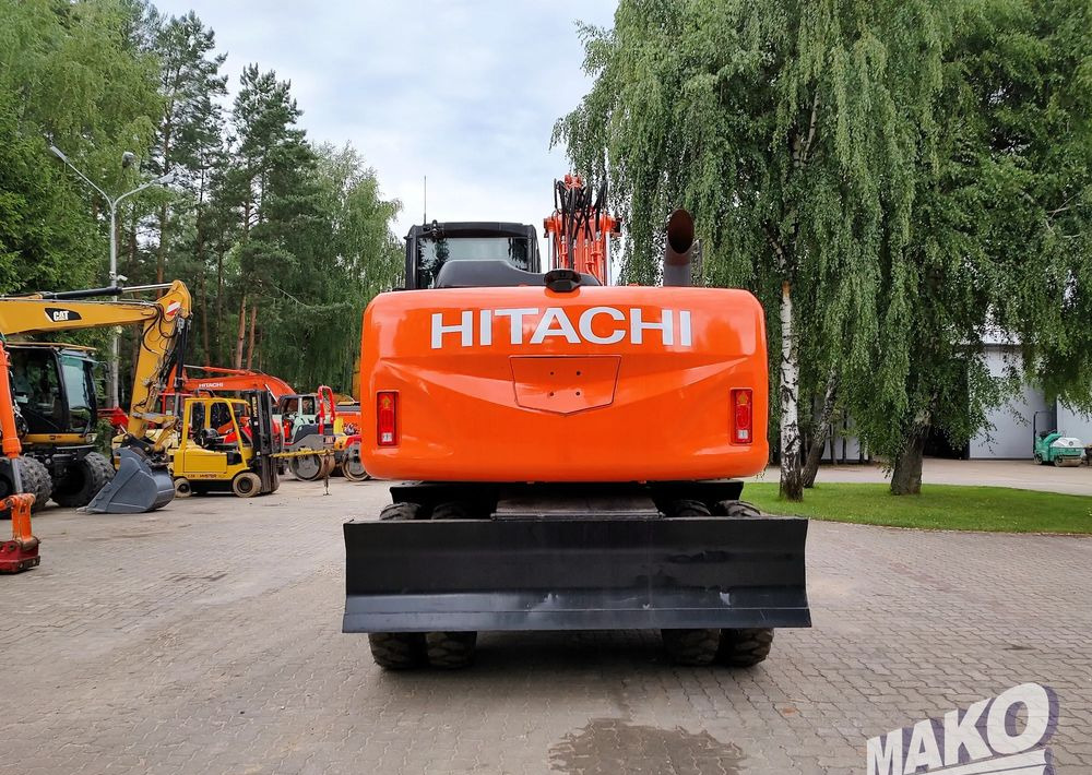 Hitachi ZX 140 - Колёсный экскаватор: фото 3 Hitachi ZX 140 - Колёсный экскаватор: фото 3