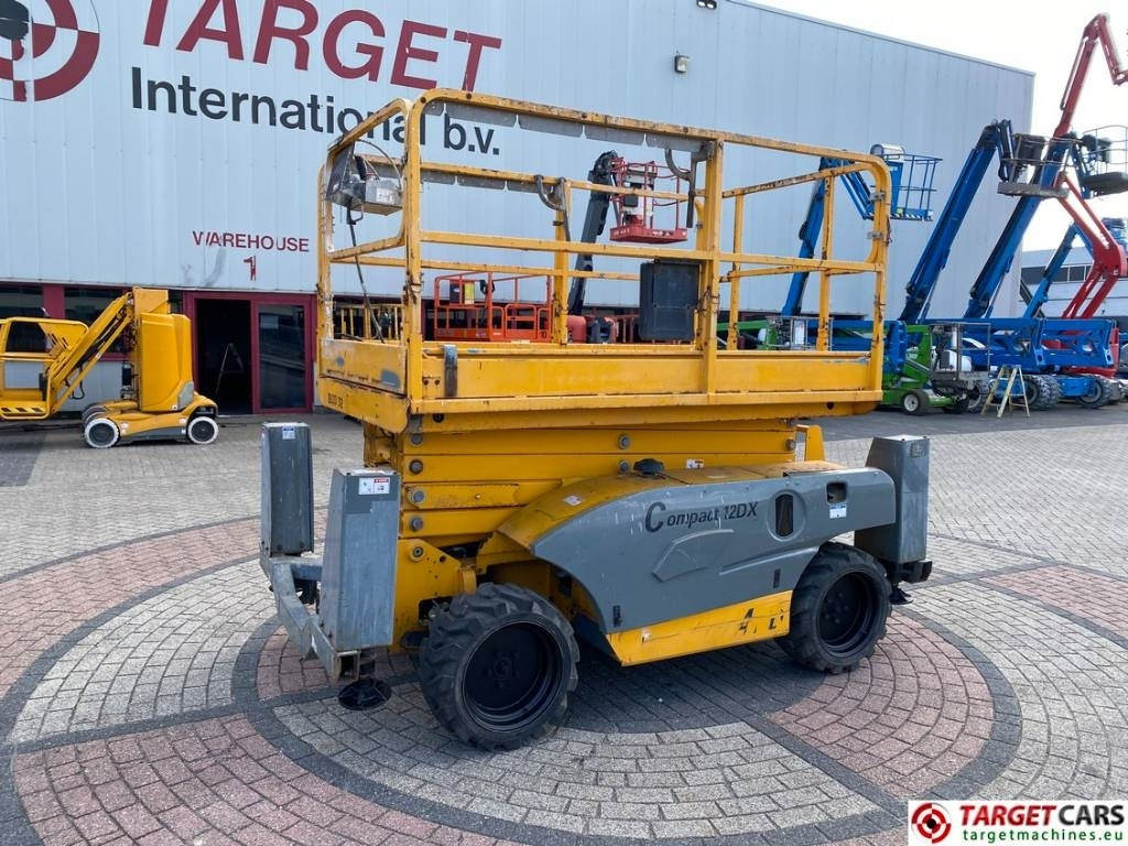 Haulotte Compact 12DX Diesel 4x4 Scissor Work Lift 1206cm - Ножничный подъемник: фото 1 Haulotte Compact 12DX Diesel 4x4 Scissor Work Lift 1206cm - Ножничный подъемник: фото 1