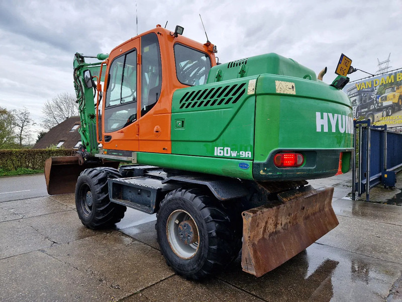 Hyundai Robex 160W-9A met 6-cilinder Cummins motor - Колёсный экскаватор: фото 1 Hyundai Robex 160W-9A met 6-cilinder Cummins motor - Колёсный экскаватор: фото 1