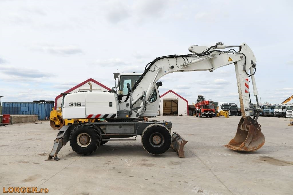 Liebherr A 316 Litronic - Колёсный экскаватор: фото 1 Liebherr A 316 Litronic - Колёсный экскаватор: фото 1