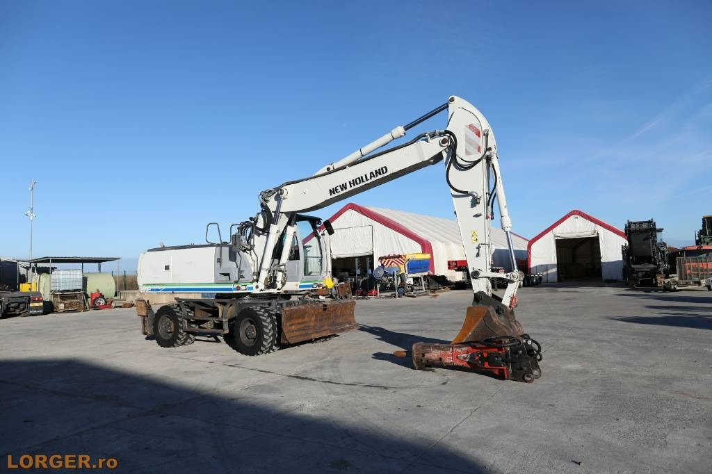 New Holland MH 6.6 + Sandvic Hammer - Колёсный экскаватор: фото 2 New Holland MH 6.6 + Sandvic Hammer - Колёсный экскаватор: фото 2