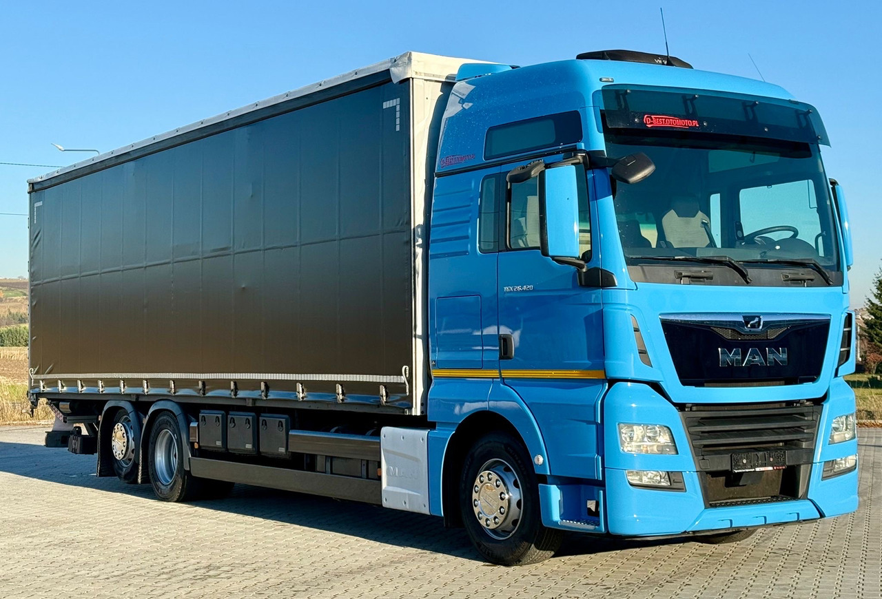 MAN TGX 26.420 / FIRANKA / WINDA / 23 EUROPALETY / 6x2 / AUTOMAT / EURO 6 / OŚ PODNOSZONA / DUŻA KABINA / 2019 ROK - Тентованный грузовик: фото 1 MAN TGX 26.420 / FIRANKA / WINDA / 23 EUROPALETY / 6x2 / AUTOMAT / EURO 6 / OŚ PODNOSZONA / DUŻA KABINA / 2019 ROK - Тентованный грузовик: фото 1