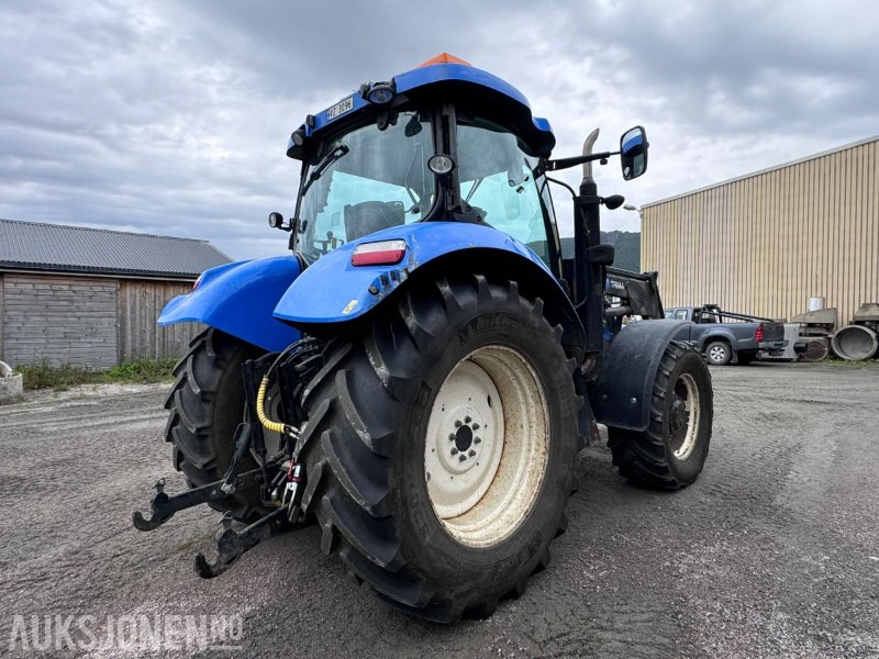 2012 New Holland T6050 med Trima +4.1P frontlaster og panser beskytter - 40 km/t - Трактор: фото 4 2012 New Holland T6050 med Trima +4.1P frontlaster og panser beskytter - 40 km/t - Трактор: фото 4