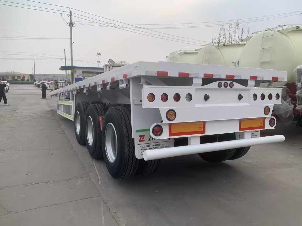 ZHICHENG Semi Flat Bed Low Bed Lowboy bed truck in New or Used Condition and various Size for Sale - Низкорамный полуприцеп: фото 3 ZHICHENG Semi Flat Bed Low Bed Lowboy bed truck in New or Used Condition and various Size for Sale - Низкорамный полуприцеп: фото 3
