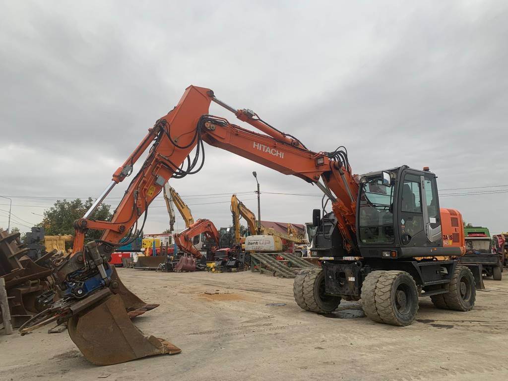 Hitachi ZX 145 W-3+SMP Rototilt  - Колёсный экскаватор: фото 1 Hitachi ZX 145 W-3+SMP Rototilt  - Колёсный экскаватор: фото 1