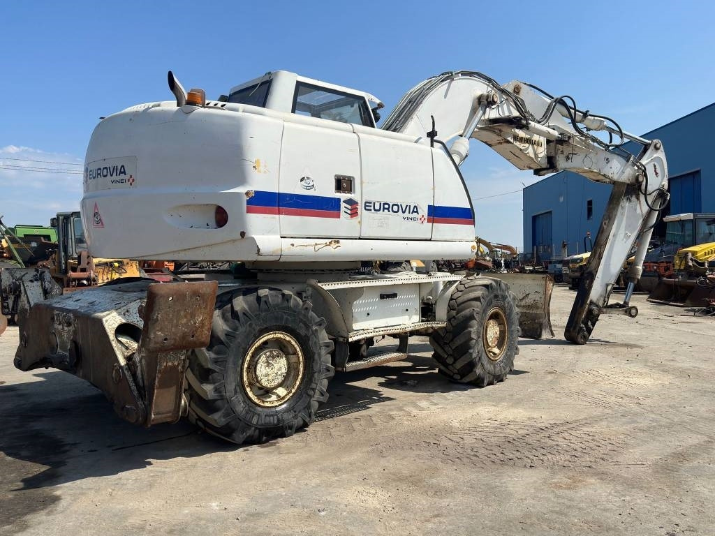 New Holland MH Plus - Колёсный экскаватор: фото 4 New Holland MH Plus - Колёсный экскаватор: фото 4