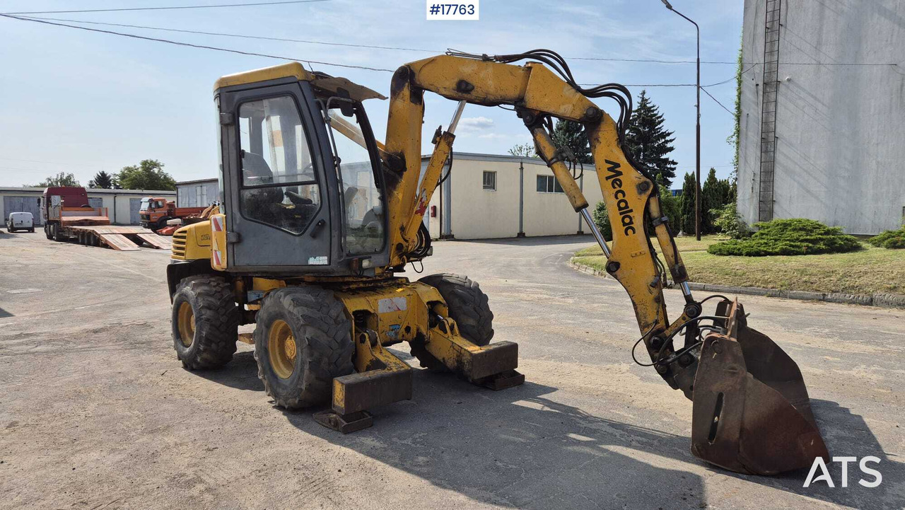 MECALAC 12MX wheeled excavator (1996) - Колёсный экскаватор: фото 2 MECALAC 12MX wheeled excavator (1996) - Колёсный экскаватор: фото 2