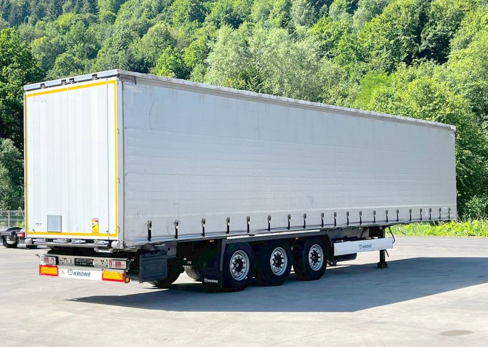 Krone Firanka Coilmulde // 9m // Alu Drzwi // Ażury // Oś podnoszona // - Тентованный полуприцеп: фото 1 Krone Firanka Coilmulde // 9m // Alu Drzwi // Ażury // Oś podnoszona // - Тентованный полуприцеп: фото 1