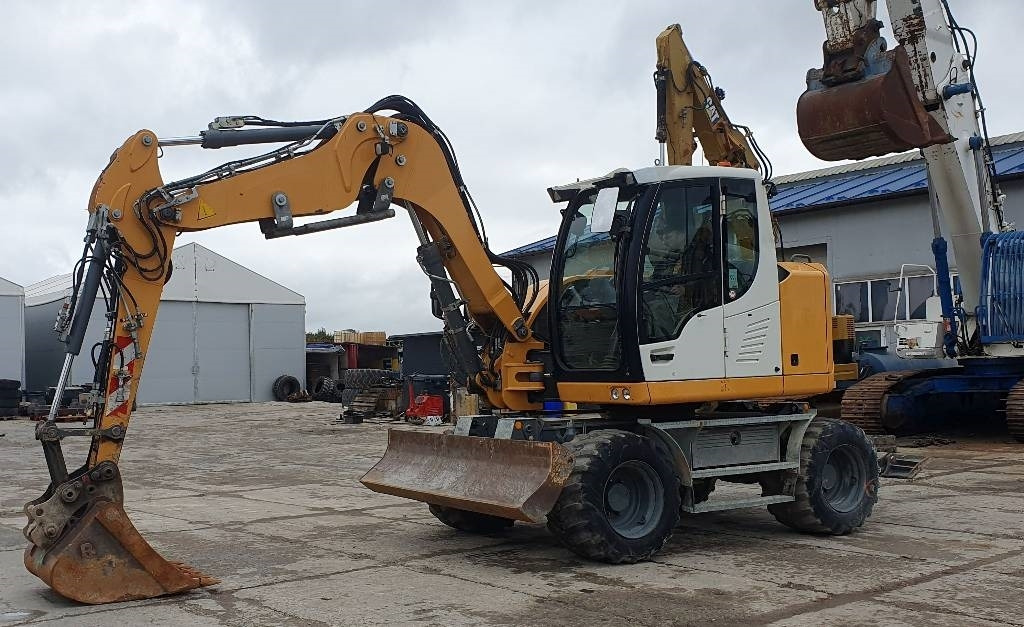 Liebherr A 910 compact - Колёсный экскаватор: фото 1 Liebherr A 910 compact - Колёсный экскаватор: фото 1