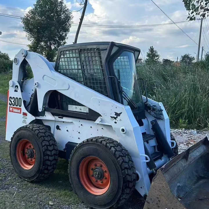Used Bob Cat Bob Cat S300 Used Mini Skid Steer Wheel Loader Multifunctional Track Loaders Bobcat S300 - Колёсный погрузчик: фото 1 Used Bob Cat Bob Cat S300 Used Mini Skid Steer Wheel Loader Multifunctional Track Loaders Bobcat S300 - Колёсный погрузчик: фото 1