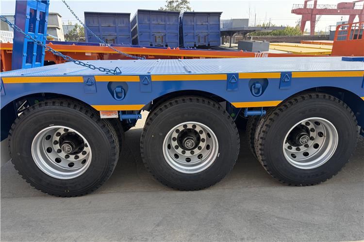 TITAN 3 Axle 80 Ton Low Bed Trailer Price for Sale In Nigeria - Низкорамный полуприцеп: фото 2 TITAN 3 Axle 80 Ton Low Bed Trailer Price for Sale In Nigeria - Низкорамный полуприцеп: фото 2