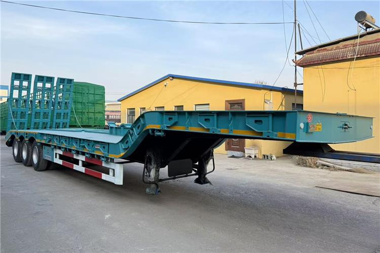 TITAN 3 Axle Low Bed Truck Price In Ghana - Низкорамный полуприцеп: фото 3 TITAN 3 Axle Low Bed Truck Price In Ghana - Низкорамный полуприцеп: фото 3