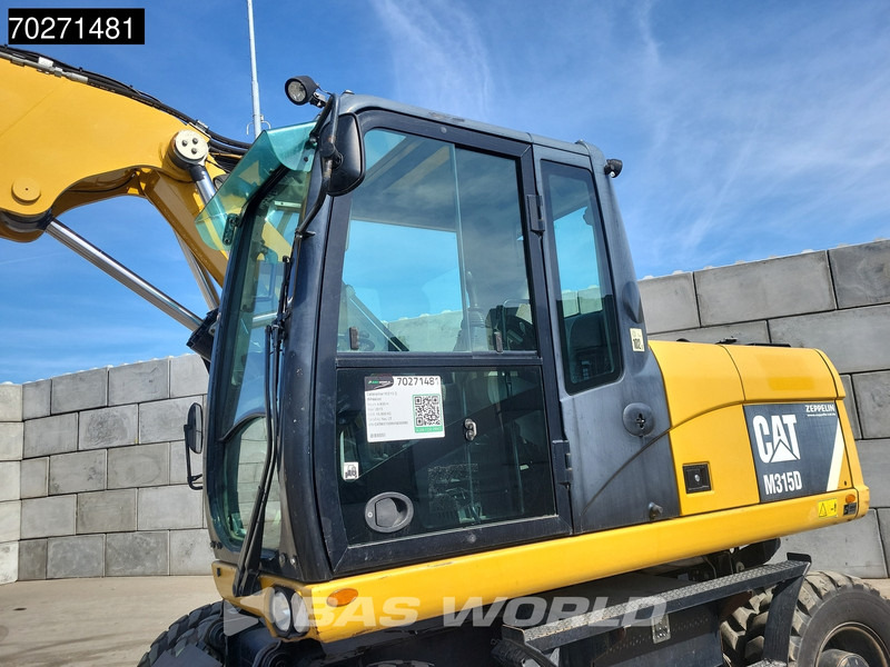 Caterpillar M315 D - Колёсный экскаватор: фото 3 Caterpillar M315 D - Колёсный экскаватор: фото 3