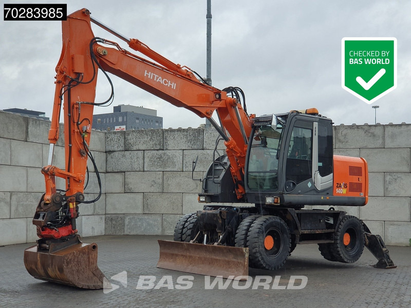 Hitachi ZX140W -3 OUTRIGGERS - ROTOTILT - Колёсный экскаватор: фото 1 Hitachi ZX140W -3 OUTRIGGERS - ROTOTILT - Колёсный экскаватор: фото 1