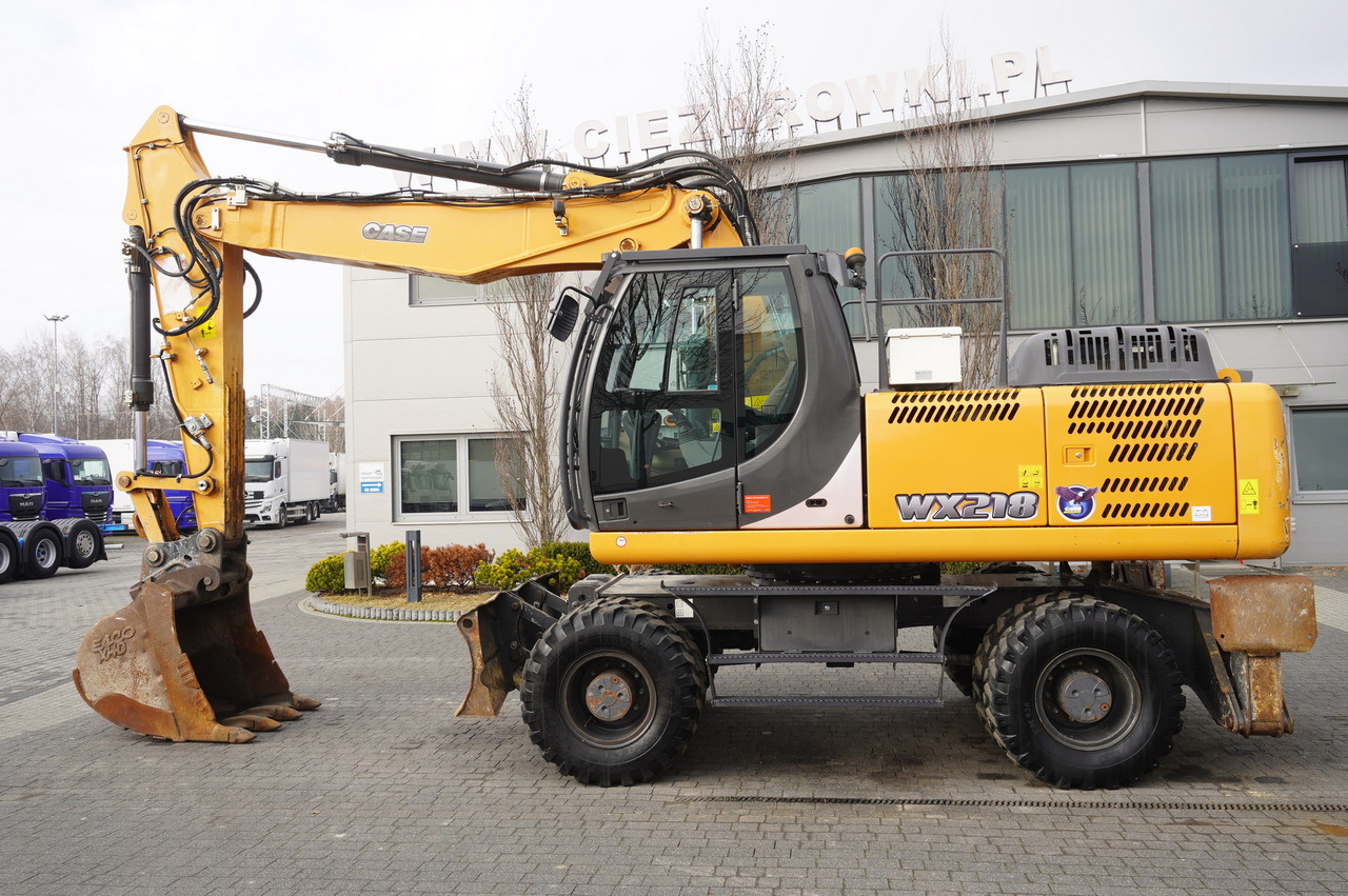 CASE WX218 / 23t wheeled excavator / 3 times folding arm - Колёсный экскаватор: фото 1 CASE WX218 / 23t wheeled excavator / 3 times folding arm - Колёсный экскаватор: фото 1
