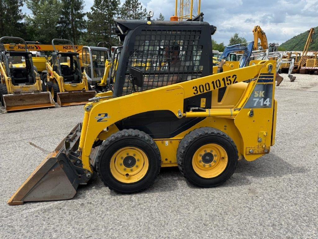 Komatsu SK714-5 (4026) - Мини-погрузчик с бортовым поворотом: фото 1 Komatsu SK714-5 (4026) - Мини-погрузчик с бортовым поворотом: фото 1