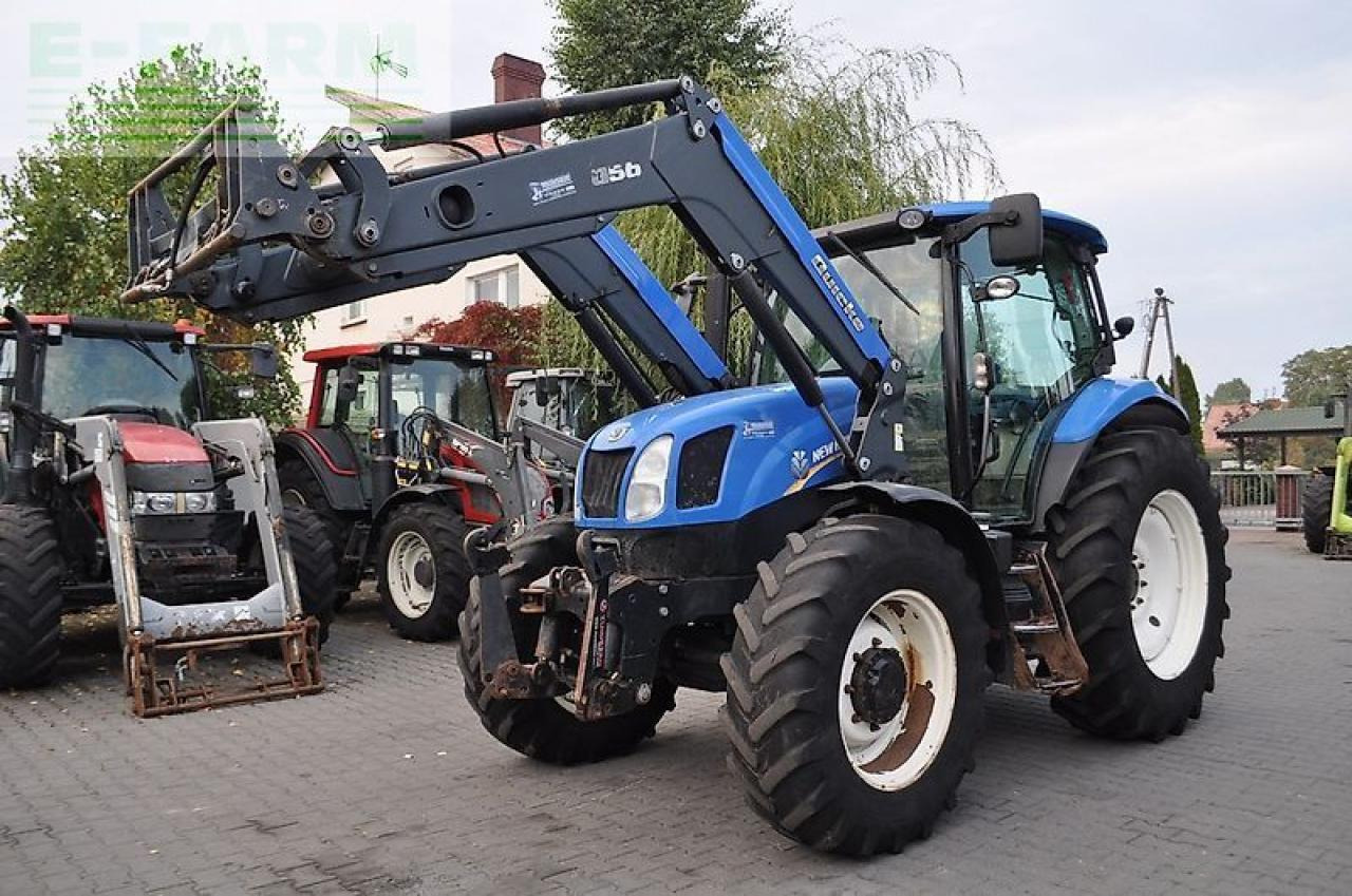 New Holland t6.140 + quicke q56 - Трактор: фото 1 New Holland t6.140 + quicke q56 - Трактор: фото 1