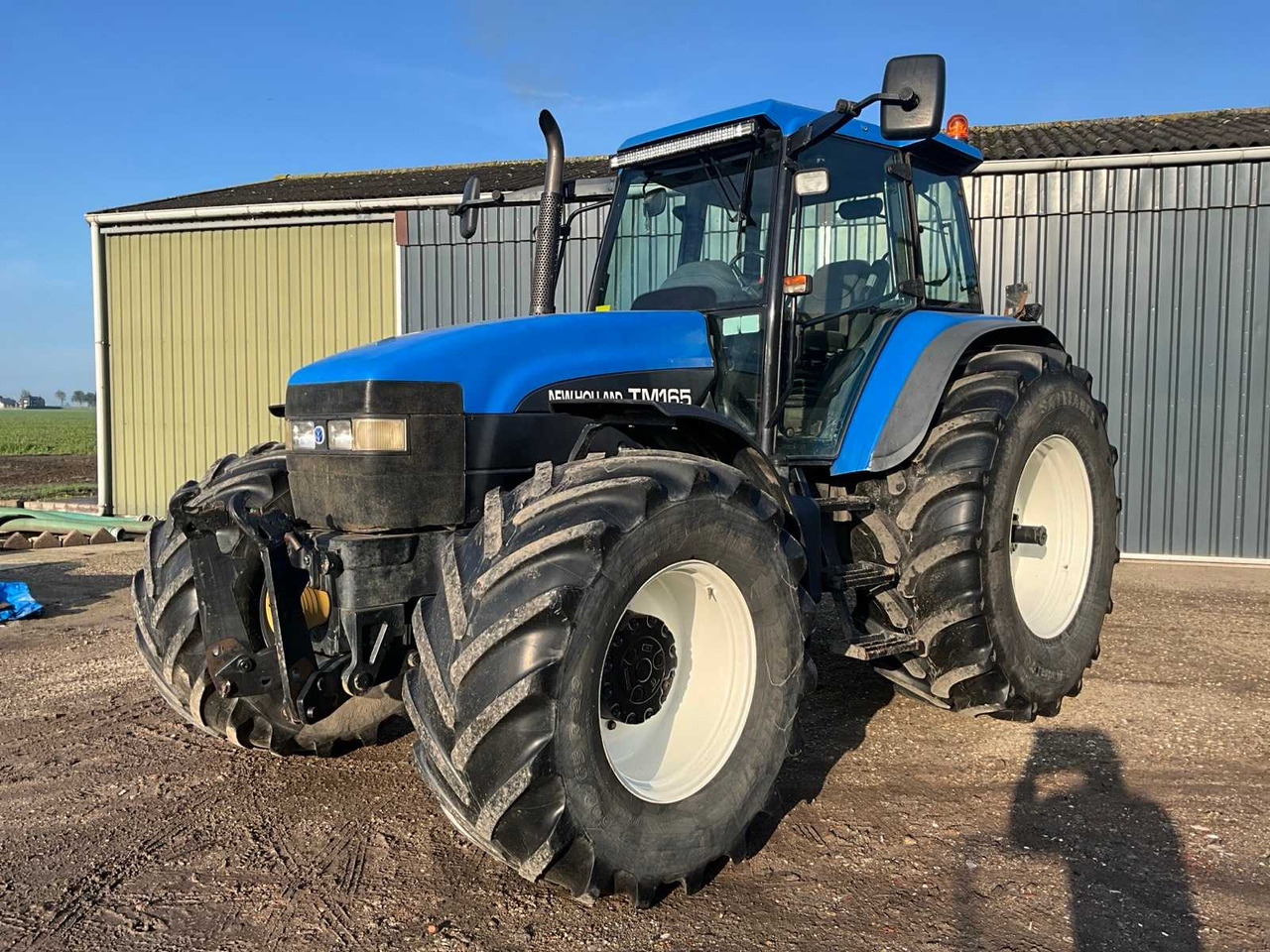 New holland TM165 - Трактор: фото 1 New holland TM165 - Трактор: фото 1