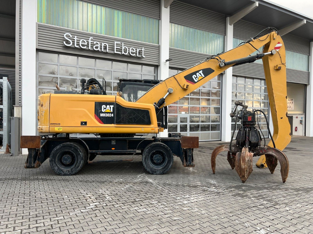 CAT MH3024 / MH 3024 / Greifer / 2018 / 10.735h - Колёсный экскаватор: фото 3 CAT MH3024 / MH 3024 / Greifer / 2018 / 10.735h - Колёсный экскаватор: фото 3