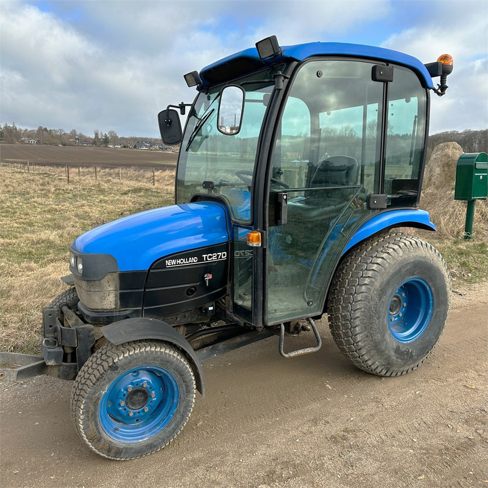 New Holland TC27D - Коммунальный трактор: фото 1 New Holland TC27D - Коммунальный трактор: фото 1