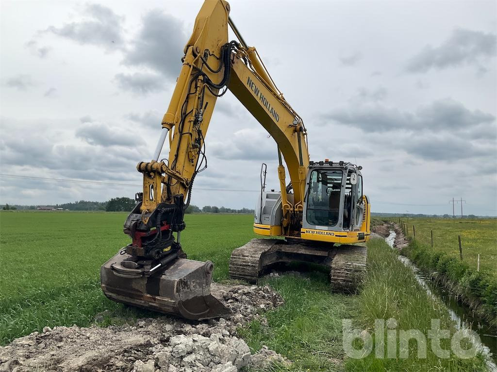 New Holland kobelco E235 B se - Гусеничный экскаватор: фото 1 New Holland kobelco E235 B se - Гусеничный экскаватор: фото 1
